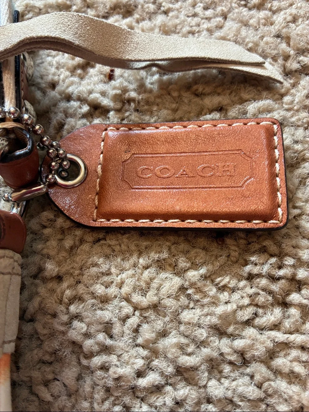 Coach Multicolor Canvas Crossbody bag with Turquoise Lining.